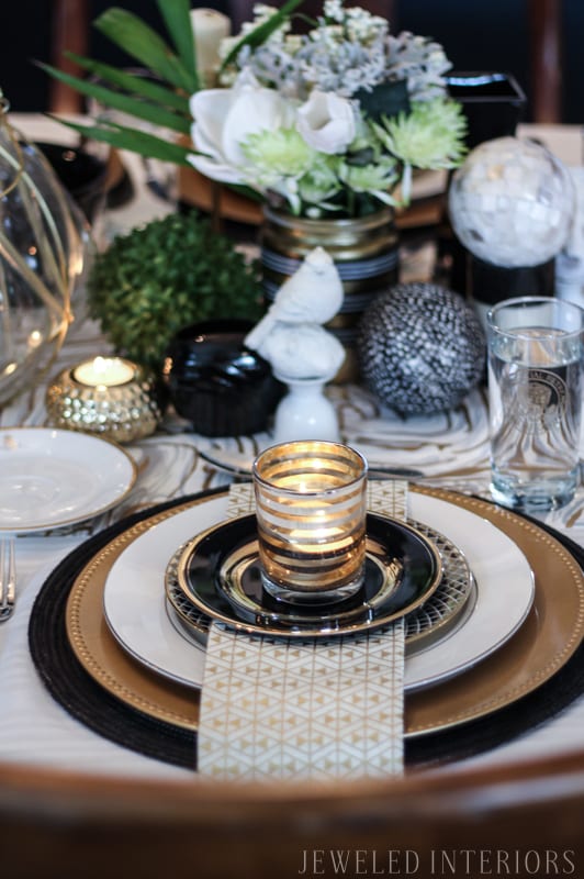 I learned so much from this 8 step tutorial on how to set a pretty tablescape! || Jeweledinteriors, jeweled interiors, party, planning, dinner, brunch, banquet, table, setting, centerpiece, placemats, napkin, pomegranate, feather, gold, salad, charger, placemat, rings, flowers, candles, vintage, dollar store, beautiful, sequin, sheepskin, texture