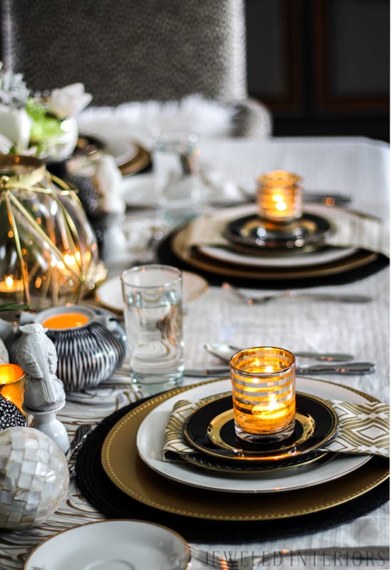 I learned so much from this 8 step tutorial on how to set a pretty tablescape! || Jeweledinteriors, jeweled interiors, party, planning, dinner, brunch, banquet, table, setting, centerpiece, placemats, napkin, pomegranate, feather, gold, salad, charger, placemat, rings, flowers, candles, vintage, dollar store, beautiful, sequin, sheepskin, texture