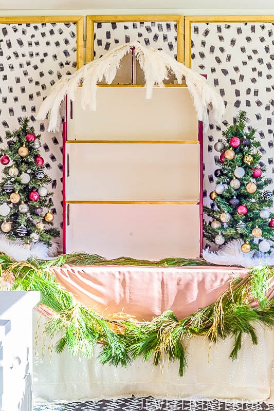 How did she make that DIY Dalmatian Print wallpaper?  It's easy!  || Jeweledinteriors, Dalmatian, diy, wallpaper, preppy, blush, peach, Burgundy, buffet, table, party, Christmas, holiday, ideas, black, white, gold, tutorial, step by step, inexpensive, paintable, wallpaper, wall paper, foam brush, backdrop, 