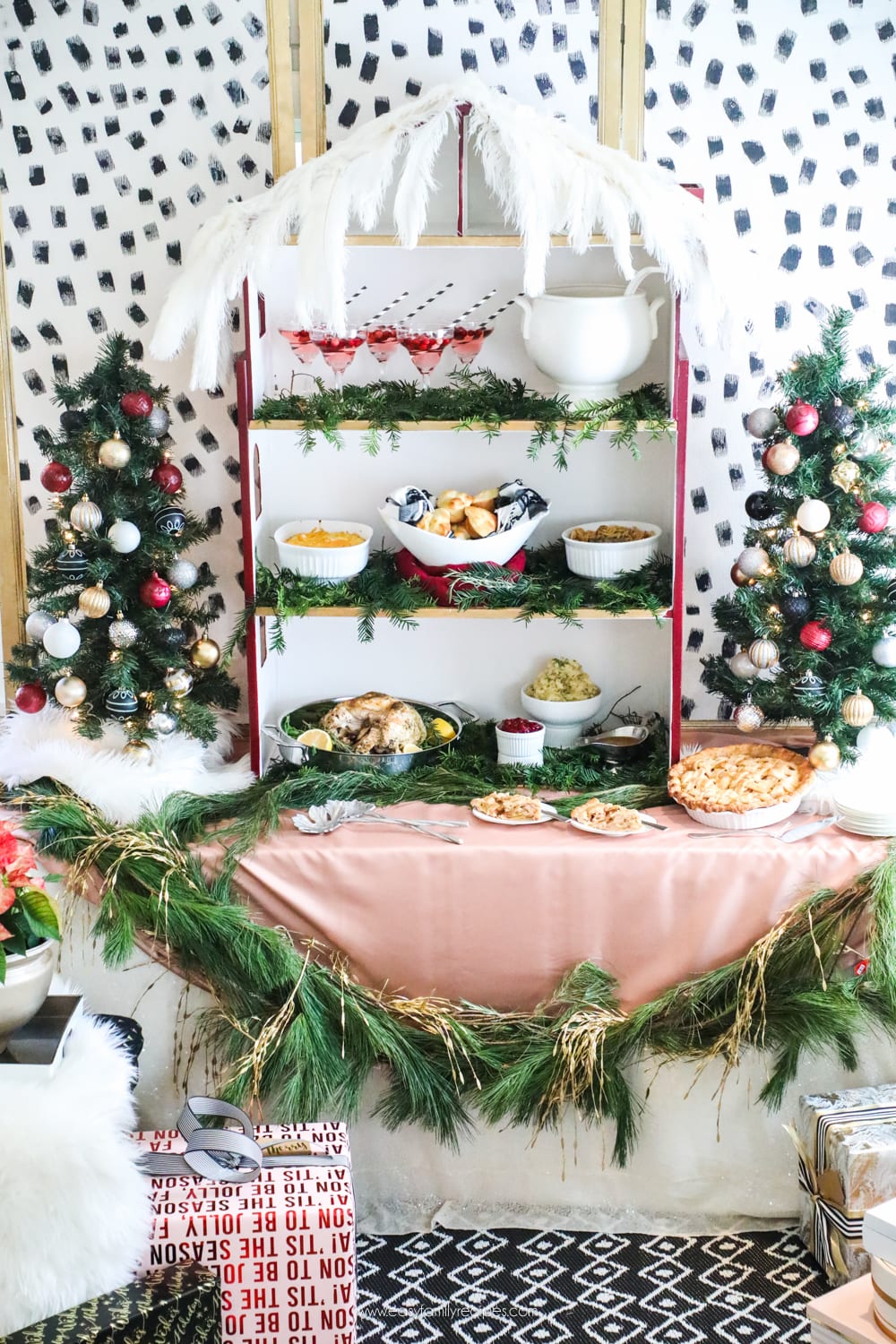 Holiday Party Buffet Table.  It's a barbie house! Looking for inspiration for Christmas Tree inspiration?  You have got to see this || Jeweled Interiors, Holiday, Home Tour, Burgundy, wine, Blush, Christmas, Decor, decoration, Ideas, Tips,  Christmas, holiday, tree,  pink, DIY, inspiration, red, maroon, ostrich feathers, poinsettia, glam, chic, peach, gold, black, white