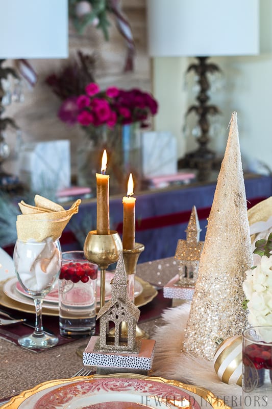 I learned so much from this 8 step tutorial on how to set a pretty tablescape! || Jeweledinteriors, jeweled interiors, party, planning, dinner, brunch, banquet, table, setting, centerpiece, placemats, napkin, pomegranate, feather, gold, salad, charger, placemat, rings, flowers, candles, vintage, dollar store, beautiful, sequin, sheepskin, texture