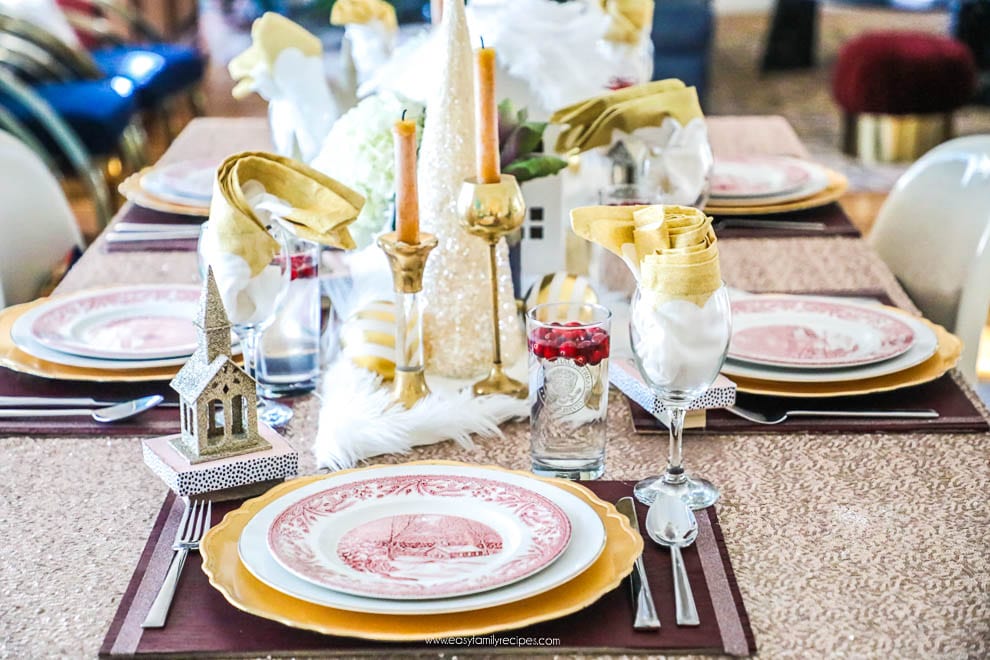 I learned so much from this 8 step tutorial on how to set a pretty tablescape! || Jeweledinteriors, jeweled interiors, party, planning, dinner, brunch, banquet, table, setting, centerpiece, placemats, napkin, pomegranate, feather, gold, salad, charger, placemat, rings, flowers, candles, vintage, dollar store, beautiful, sequin, sheepskin, texture