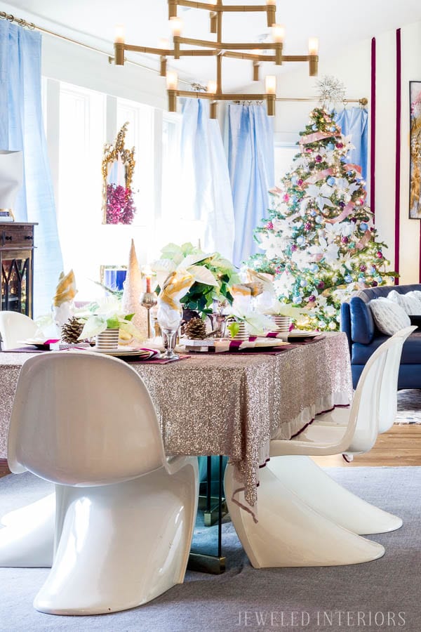 THIS DINING ROOM! Looking for inspiration for a eclectic, chic, and glam Christmas? Jeweled Interiors, Holiday, Home Tour, Burgundy, cranberry, blush, Decor, Ideas, Tips, wreaths, Christmas, tree, decor, decorations, DIY, inspiration, red, maroon, wine, home tour, poinsettia, glam, chic, peach, gold, black, white, Panton, chairs, brass, chandelier, tablescape, pinecones