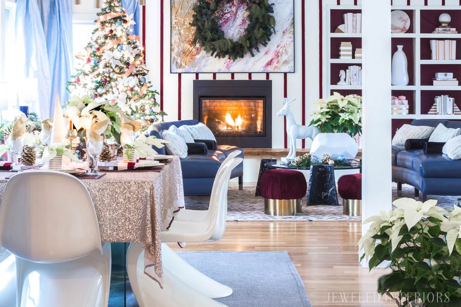 THIS DINING ROOM! Looking for inspiration for an eclectic, chic, and glam Christmas? Jeweled Interiors, Holiday, Home Tour, Burgundy, cranberry, blush, Decor, Ideas, Tips, wreaths, Christmas, tree, decor, decorations, DIY, inspiration, red, maroon, wine, home tour, poinsettia, glam, chic, peach, gold, black, white, Panton, chairs, brass, chandelier, tablescape,