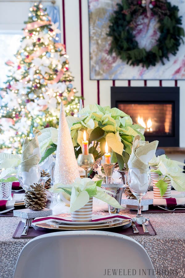 THIS DINING ROOM! Looking for inspiration for a eclectic, chic, and glam Christmas? Jeweled Interiors, Holiday, Home Tour, Burgundy, cranberry, blush, Decor, Ideas, Tips, wreaths, Christmas, tree, decor, decorations, DIY, inspiration, red, maroon, wine, home tour, poinsettia, glam, chic, peach, gold, black, white, Panton, chairs, brass, chandelier, tablescape, pinecones