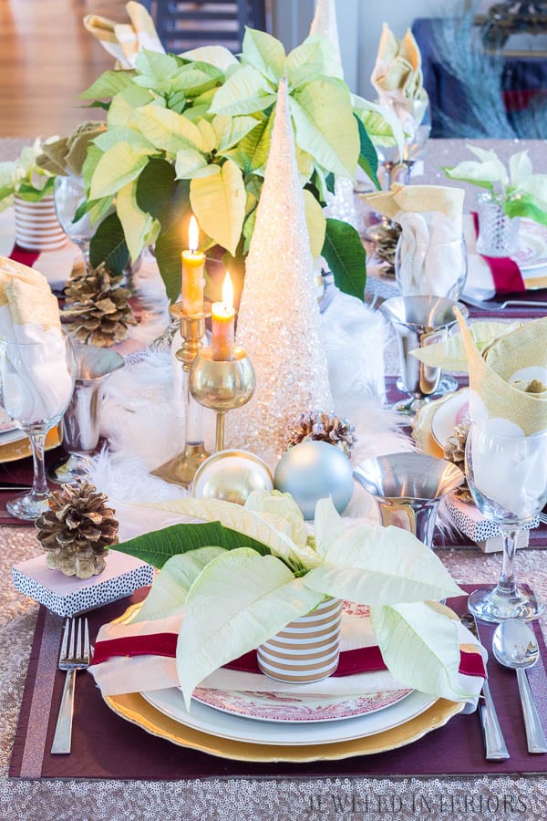 A Poinsettia tablescape: Looking for inspiration for a eclectic, chic, an glam Christmas? You have got to see this! Jeweled Interiors, Holiday, Home Tour, Burgundy, cranberry, blush, Christmas, Decor, Ideas, Tips, wreaths, Christmas, tree, decor, decorations, DIY, inspiration, red, maroon, wine, home tour, poinsettia, glam, chic, peach, gold, black, white