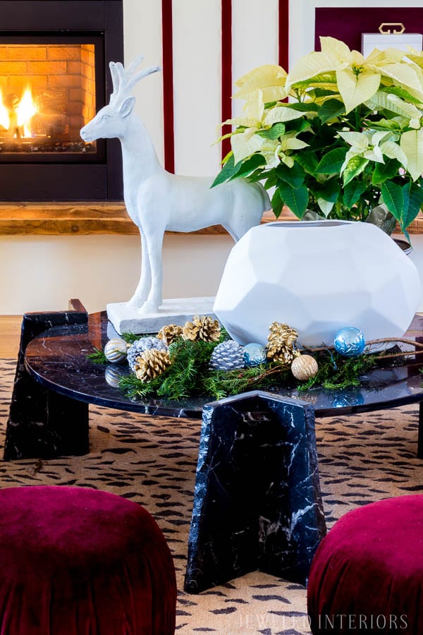 HOLIDAY COFFEE TABLE DECOR || Looking for inspiration for an eclectic, chic, and glam Christmas? Jeweled Interiors, Holiday, Home Tour, Burgundy, cranberry, blush, Decor, Ideas, Tips, black, marble, Christmas, tree, decor, decorations, DIY, inspiration, red, maroon, wine, home tour, poinsettia, glam, chic, peach, gold, black, white, statue, reindeer