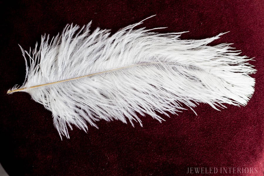 Ostrich feather || Looking for inspiration for Christmas Tree inspiration?  You have got to see this || Jeweled Interiors, Holiday, Home Tour, Burgundy, wine, Blush, Christmas, Decor, decoration, Ideas, Tips,  Christmas, holiday, tree,  pink, DIY, inspiration, red, maroon, ostrich feathers, poinsettia, glam, chic, peach, gold, black, white , eclectic, chic,  romantic