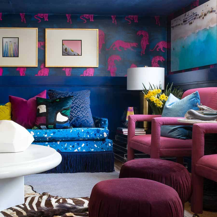 Check out this amazing Terrazzo, blue, velvet, sofa with custom fabric from Spoonflower. I can't believe those chairs were painted. I Love the Tiger wallpaper too.