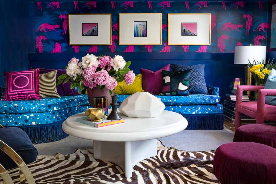 This bold combination is heaven! Living room, dramatic, blue, tiger wallpaper, wallpapered living room, terrazzo, terrazzo sofa, terrazzo fabric, Velvet, sofa with fringe, bullion, miles redd, Luke Edward hall, Wes Anderson, Karl Springer, coffee table, peonies, tiger wallpaper, spoonflower, lamps plus, fringe market, roostery