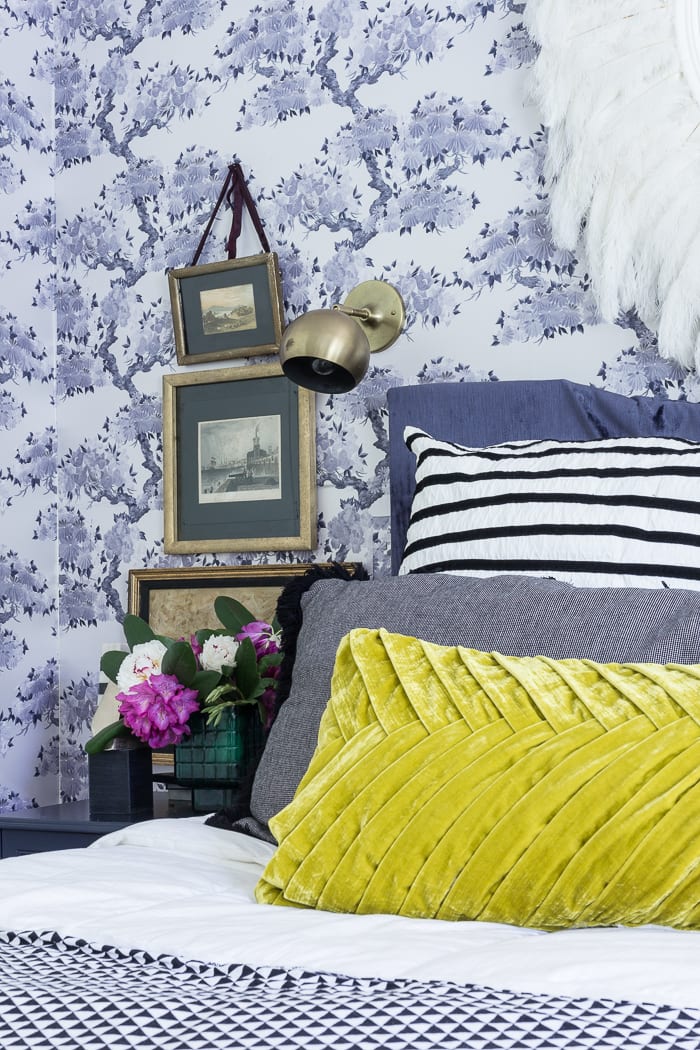 Kimono Wallpaper makes for a stunning chinoiserie bedroom with vibrant accents of mustard yellow and purple.