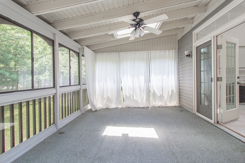 sunroom big reveal, maximalist room, maximalist sofa, maximalist sunroom, blue sofa, sofa with fringe, fringed sofa, terrazzo sofa, jeweled interiors, budget make over, budget sunroom makeover, bed swing, twin bed swing, sunroom bed swing, bohemian sunroom, colorful sunroom, Jeweledinteriors, DIYs