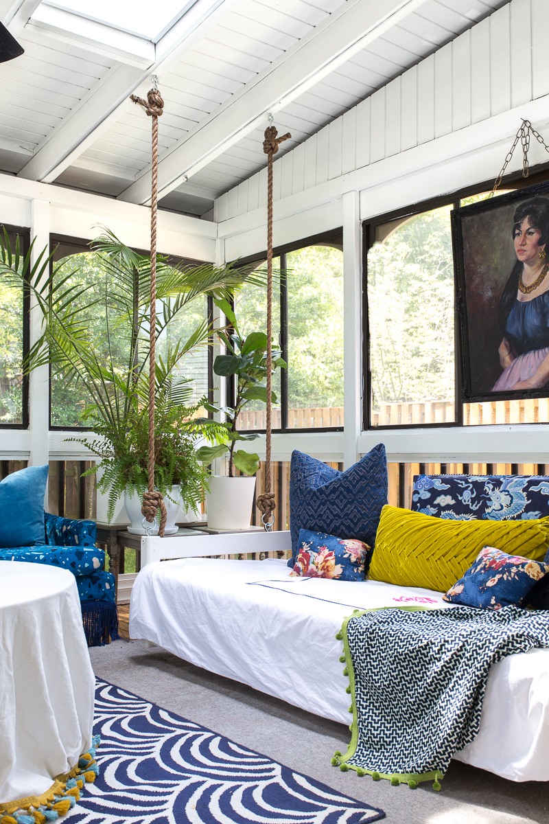 sunroom big reveal, maximalist room, maximalist sofa, maximalist sunroom, blue sofa, sofa with fringe, fringed sofa, terrazzo sofa, jeweled interiors, budget make over, budget sunroom makeover,  bed swing, twin bed swing, sunroom bed swing, bohemian sunroom, colorful sunroom, Jeweledinteriors, DIYs