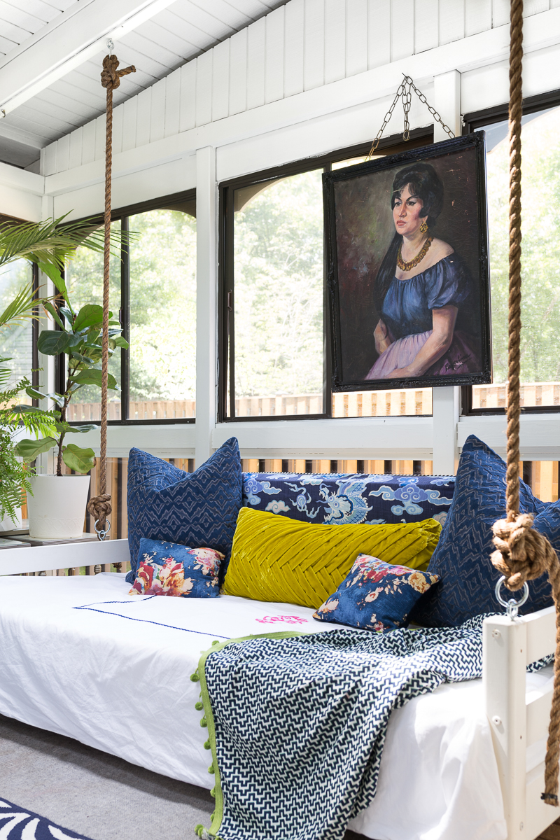 You've got to see this! sunroom big reveal, maximalist room, maximalist sofa, maximalist sunroom, blue sofa, sofa with fringe, fringed sofa, terrazzo sofa, jeweled interiors, budget make over, budget sunroom makeover,  bed swing, twin bed swing, sunroom bed swing, bohemian sunroom, colorful sunroom, Jeweledinteriors, DIYs