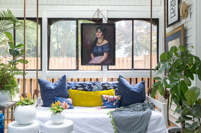 You've got to see this! sunroom big reveal, maximalist room, maximalist sofa, maximalist sunroom, blue sofa, sofa with fringe, fringed sofa, terrazzo sofa, jeweled interiors, budget make over, budget sunroom makeover,  bed swing, twin bed swing, sunroom bed swing, bohemian sunroom, colorful sunroom, Jeweledinteriors, DIYs