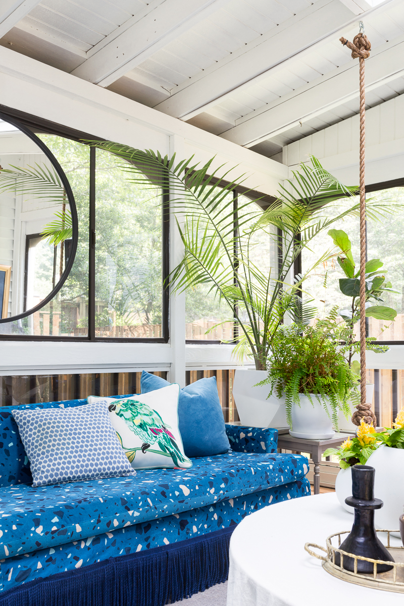 You've got to see this! sunroom big reveal, maximalist room, maximalist sofa, maximalist sunroom, blue sofa, sofa with fringe, fringed sofa, terrazzo sofa, jeweled interiors, budget make over, budget sunroom makeover,  bed swing, twin bed swing, sunroom bed swing, bohemian sunroom, colorful sunroom, Jeweledinteriors, DIYs