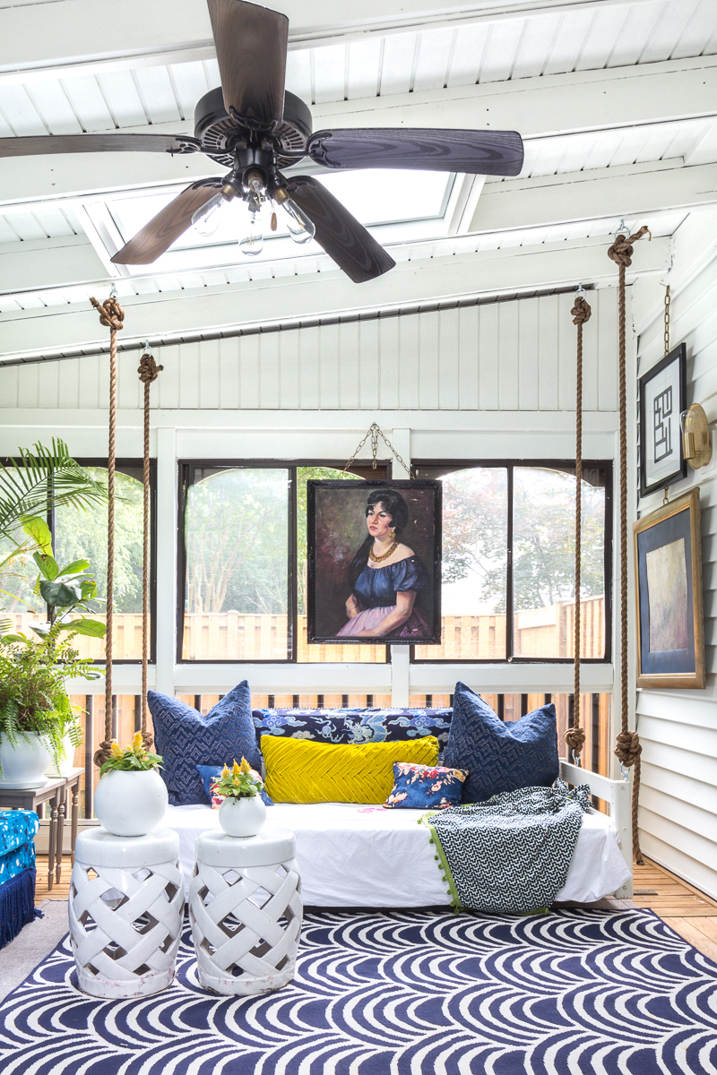 sunroom big reveal, maximalist room, maximalist sofa, maximalist sunroom, blue sofa, sofa with fringe, fringed sofa, terrazzo sofa, jeweled interiors, budget make over, budget sunroom makeover,  bed swing, twin bed swing, sunroom bed swing, bohemian sunroom, colorful sunroom, Jeweledinteriors, DIYs