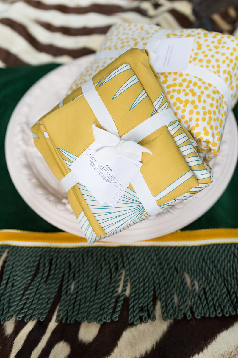 Flat lay for the guest bedroom.  Spoonflower fabric, pink paint, yellow fabric, and a bohemian flair 