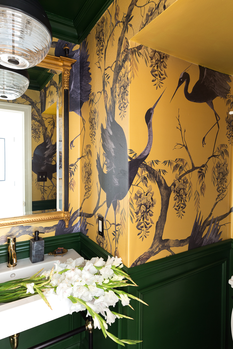 You've got to see this! A stunning yellow and green powder room by jeweled interiors using fine and Dany co wallpaper
