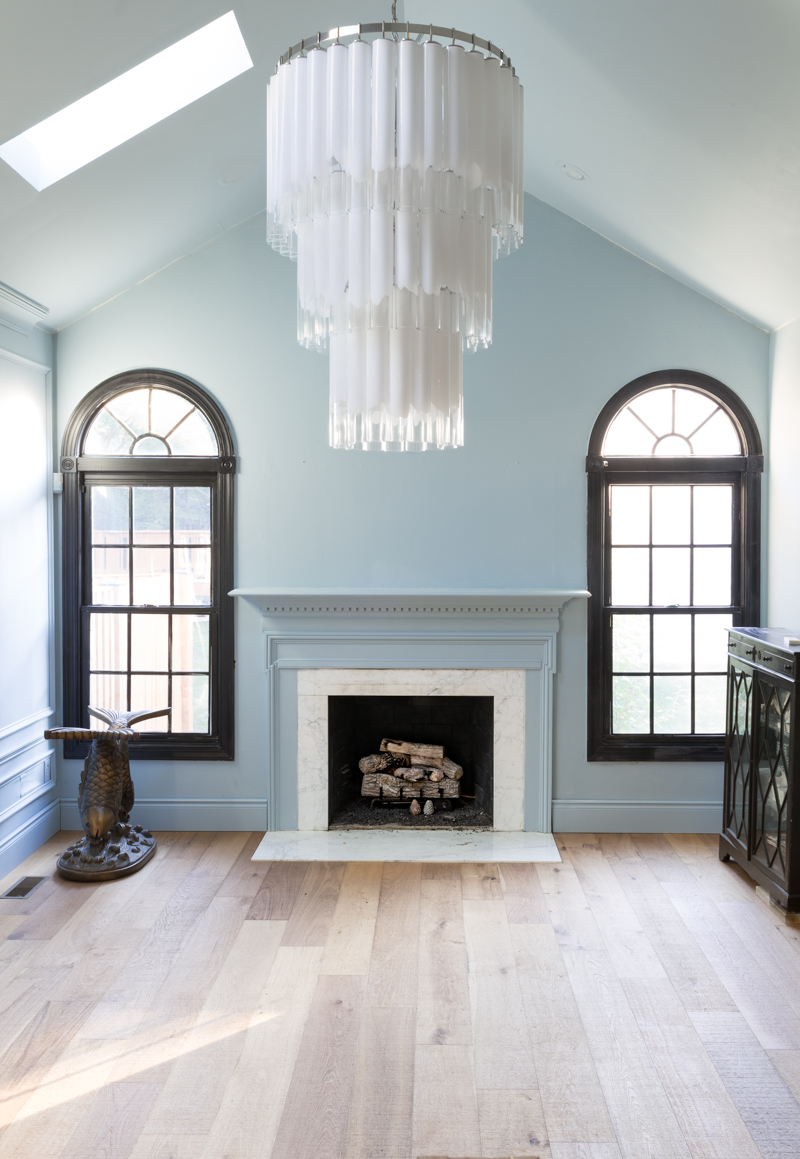 leopard chairs on lifecor flooring, Anton Fresh Aire, life core engineered hardwoods, blue walls, black trim, oversized chandelier, hardwood floors