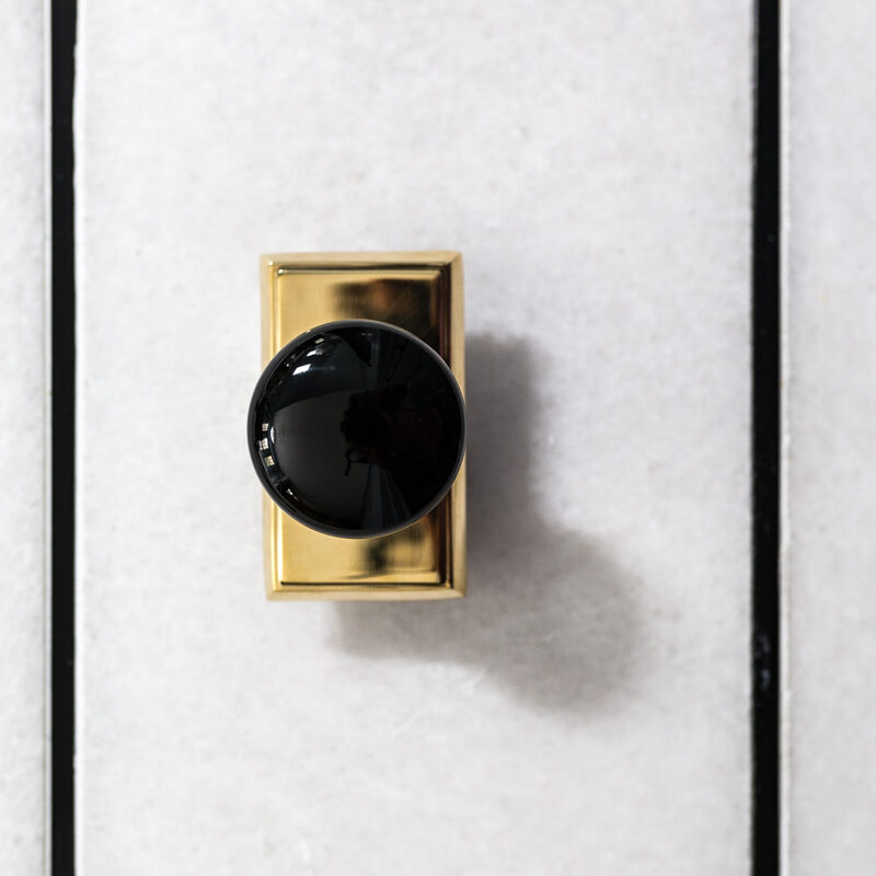 unlacqured prass Emtek hardware with ebony knob