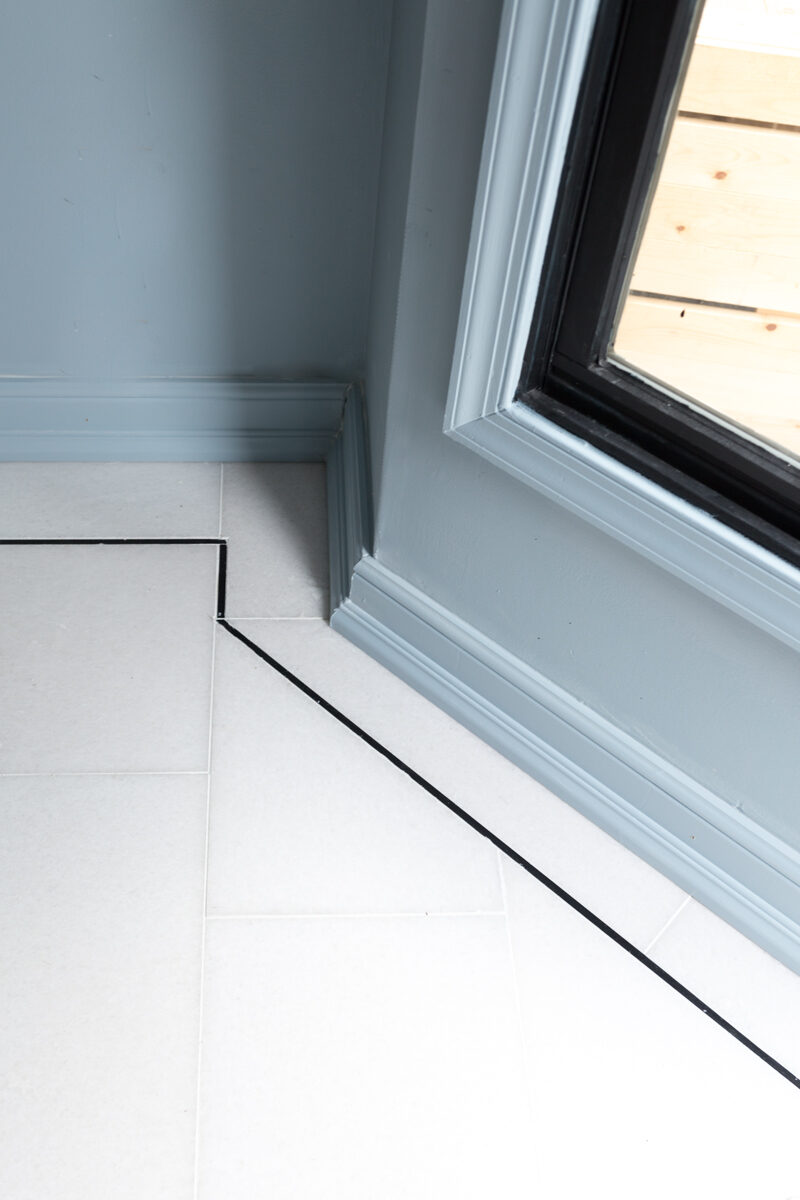 The Tile Shop San Dona marble floors with black pinstripe and Parma grey walls