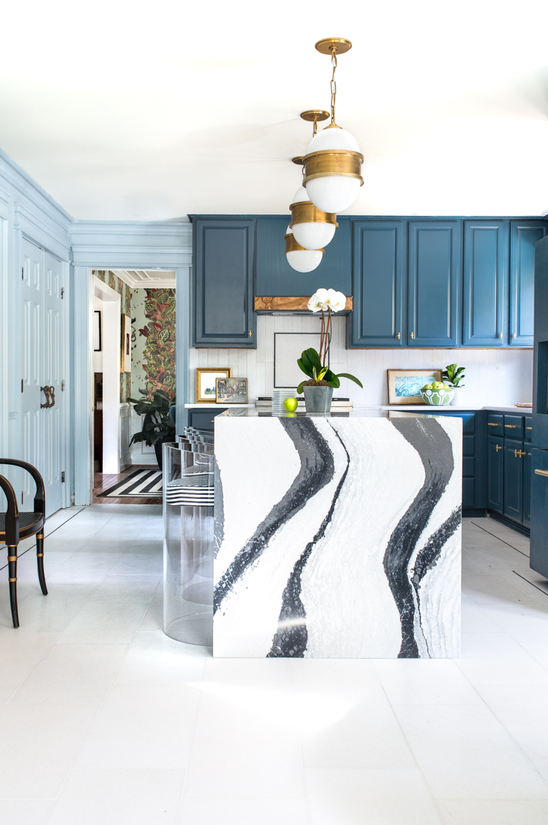 Jeweled interiors Fall 2019 ORC kitchen, Cambria Bentley island, Broomley Sconces, The tile shop marble tile, N’Hance cabinets, Schaub handles, Milton and king candy stripe chairs,
