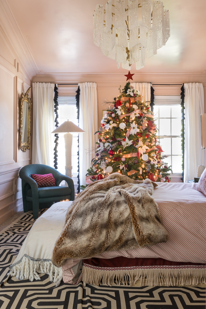 You've got to see master bedroom Christmas tree ideas in Jewel Marlowe's pink and red bedroom, embroidered sheets, crane and canopy, curious department