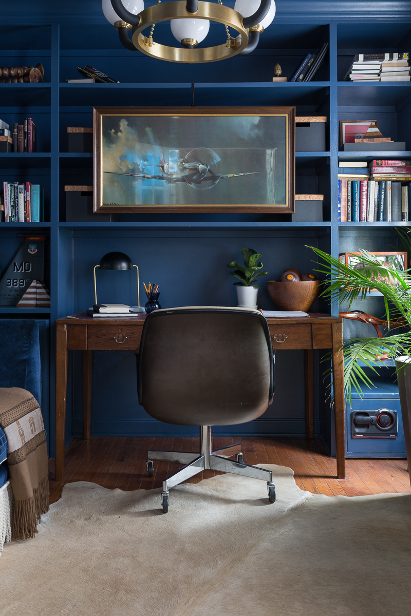 CHECK OUT this office reveal!  Stiffkey blue, spoonflower, farrow and ball, military office, Air Force office, Werner, Hudson valley lighting, hvlg, fringed sofa, airplane art, navy blue office, pilot's office, masculine office, navy blue office, antique desk, antique bookcase