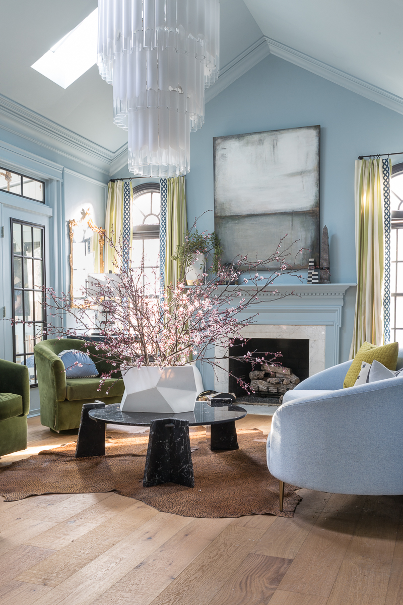 Jewel Marlowe Home Tour, Spring 2020, Living room, parma gray, light blue, oversized chandelier, black marble coffee table
