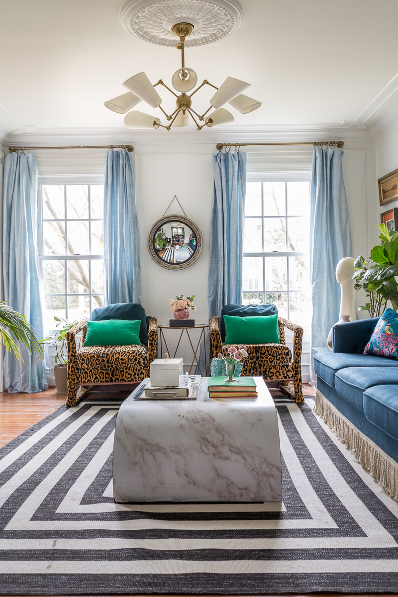 You have to see the Jewel Marlowe home tour! Leopard chairs, striped rug, silk curtains, marble coffee table, Amanda West Songbird Velvet cushion