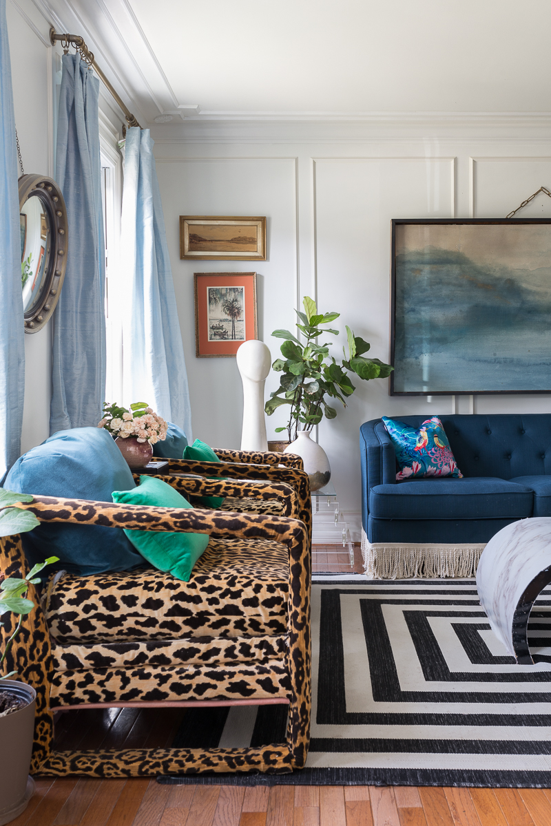 You have to see the Jewel Marlowe home tour! Leopard chairs, striped rug, silk curtains, marble coffee table, Amanda West Songbird Velvet cushion