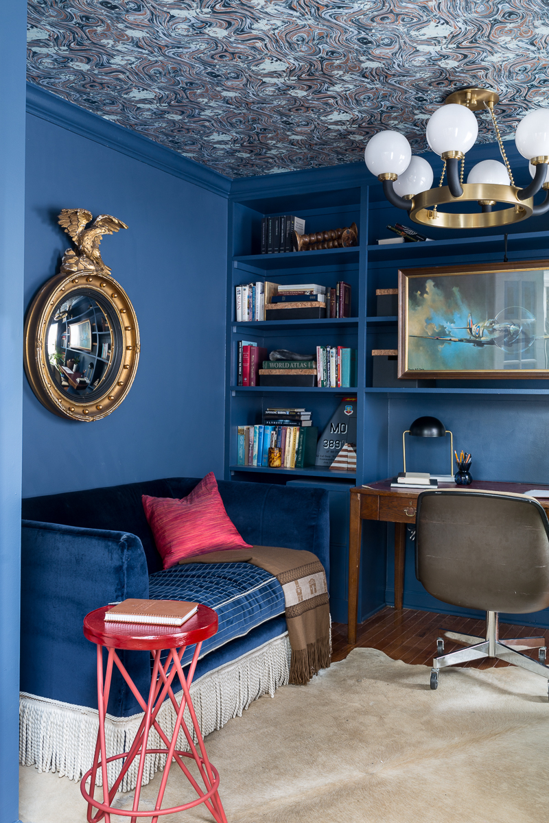 CHECK OUT this office reveal!  Stiffkey blue, spoonflower, farrow and ball, Werner, Hudson valley lighting, hvlg, fringed sofa, airplane art, navy blue office, pilot's office, masculine office, navy blue office, antique desk, antique bookcase