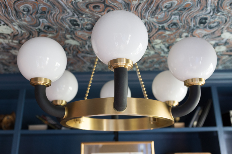 CHECK OUT this office reveal!  Werner chandelier, Stiffkey blue, spoonflower, farrow and ball, Werner, Hudson valley lighting, hvlg, airplane art, navy blue office, pilot's office, masculine office, navy blue office, antique desk, antique bookcase