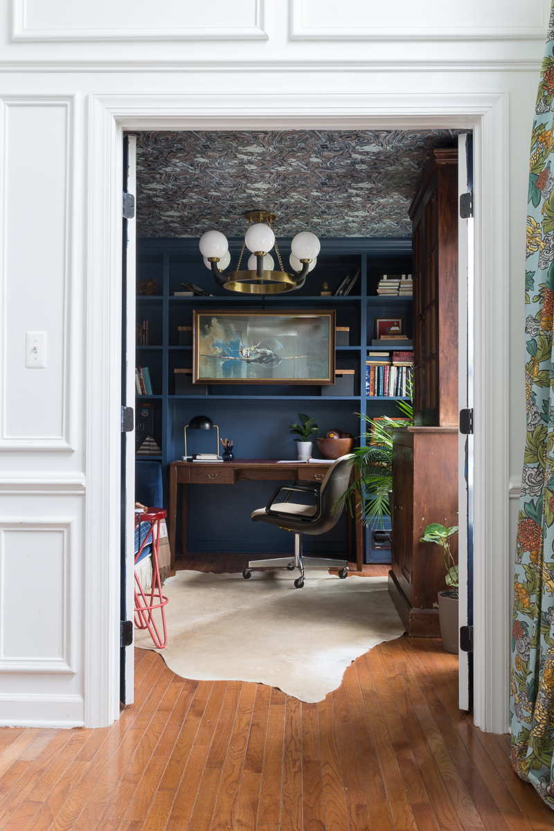 CHECK OUT this office reveal!  Stiffkey blue, spoonflower, farrow and ball, Werner, Hudson valley lighting, hvlg, fringed sofa, airplane art, navy blue office, pilot's office, masculine office, navy blue office, antique desk, antique bookcase