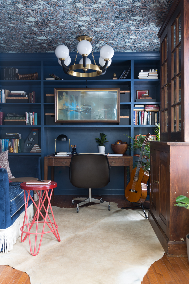 CHECK OUT this office reveal!  Stiffkey blue, spoonflower, farrow and ball, Werner, Hudson valley lighting, hvlg, fringed sofa, airplane art, navy blue office, pilot's office, masculine office, navy blue office, antique desk, antique bookcase