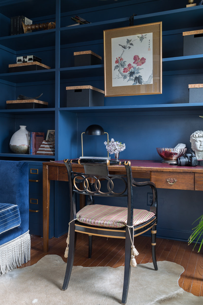 Jeweled Interiors Stiffkey Blue, Farrow and Ball, office, with built in shelves, and organization boxes, and antique desk and chair, wallpapered ceiling