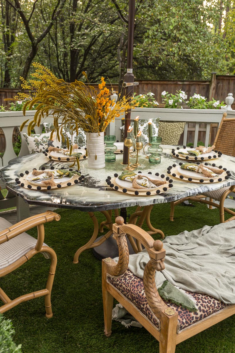 patio decorating ideas, patio ideas, grass rug, antique bench, agate table, deck, entertaining, fall, Phiftertex, bamboo chair, Anthropologie