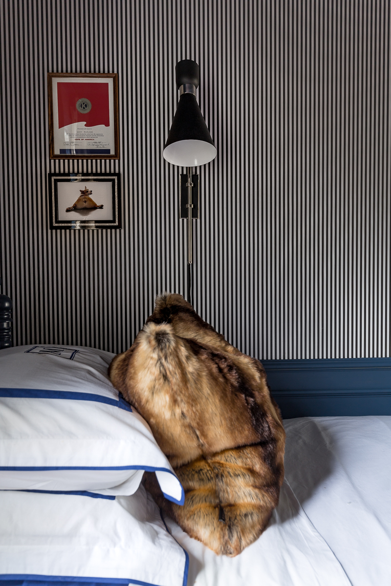 Masculine Traditional Bedroom, reveal, boy's bedroom, boy bedroom, man bedroom, British design, grand millennial, traditional design, Stiffkey blue, Wagner chandelier, modern chandelier, black and white striped wallpaper, Milton and king, candy stripe, gallery wall, , faux fur pillow