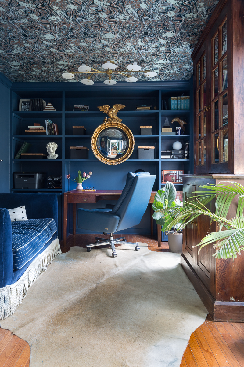 home office ideas, office, stiffkey blue, farrow and ball, wallpapered ceiling, campaign office desk, leather chair, cowhide rug, Giselle flush mount, Mitzi, office organization, antique mirror