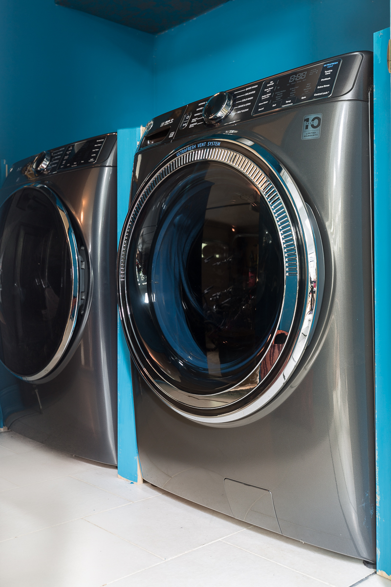 You have to see the updates to this laundry room |Ge, washer and dryer, antimicrobial, no mold, graham and brown wallpaper, small laundry room ideas, teal, wallpaper, laundry room, metallic wallpaper.