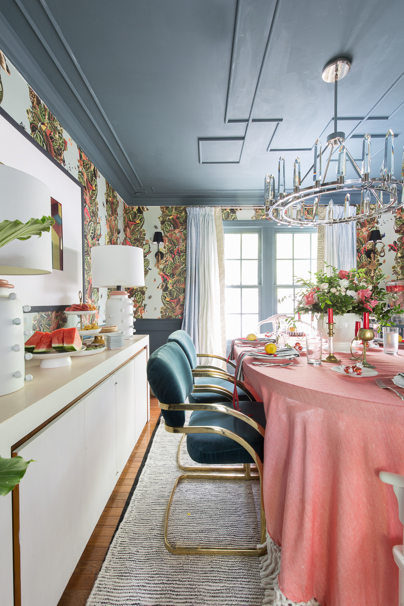 eclectic dining room, ceiling treatment, inchyra blue, Farrow and Ball, wallpaper, bold, modern chandelier, crystorama, Watson chandelier, crystal, silk drapes, milo baughman, chairs, mcm, wishbone chairs, flower arrangement, floral arrangement, tablescape, summer, maximalist dining room