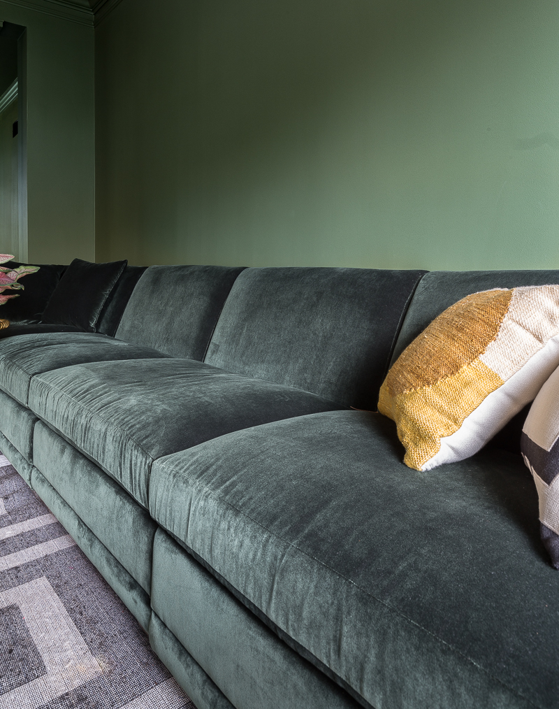 tone on tone sofa, color clashing sofa, pyramid coffee table, snake side table, green velvet sofa, one room challenge
