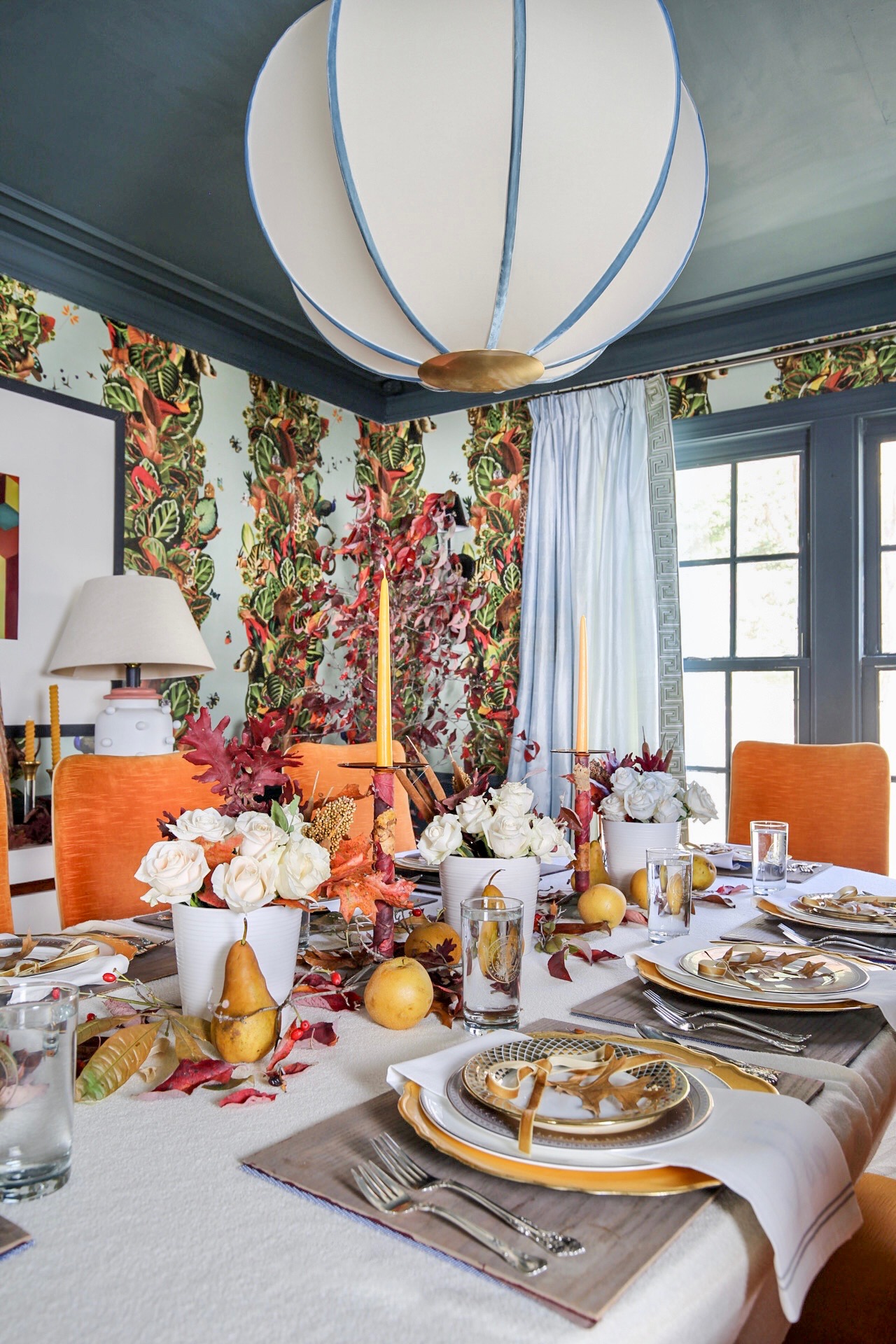 maximalist decor, maximalist dining room, fall dining room decor, fall tablescape, jupiter chandelier, orange chairs