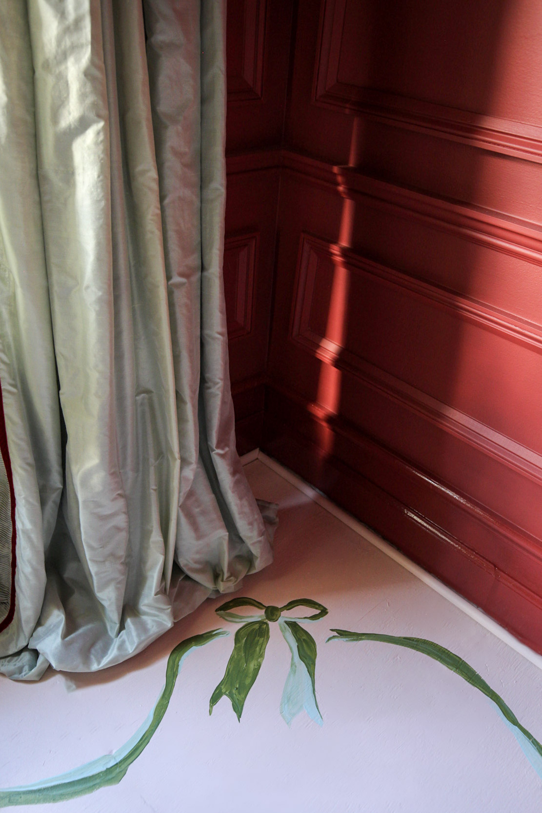 painted floor boards, bows, coquette, red walls, silk ruffle drapes