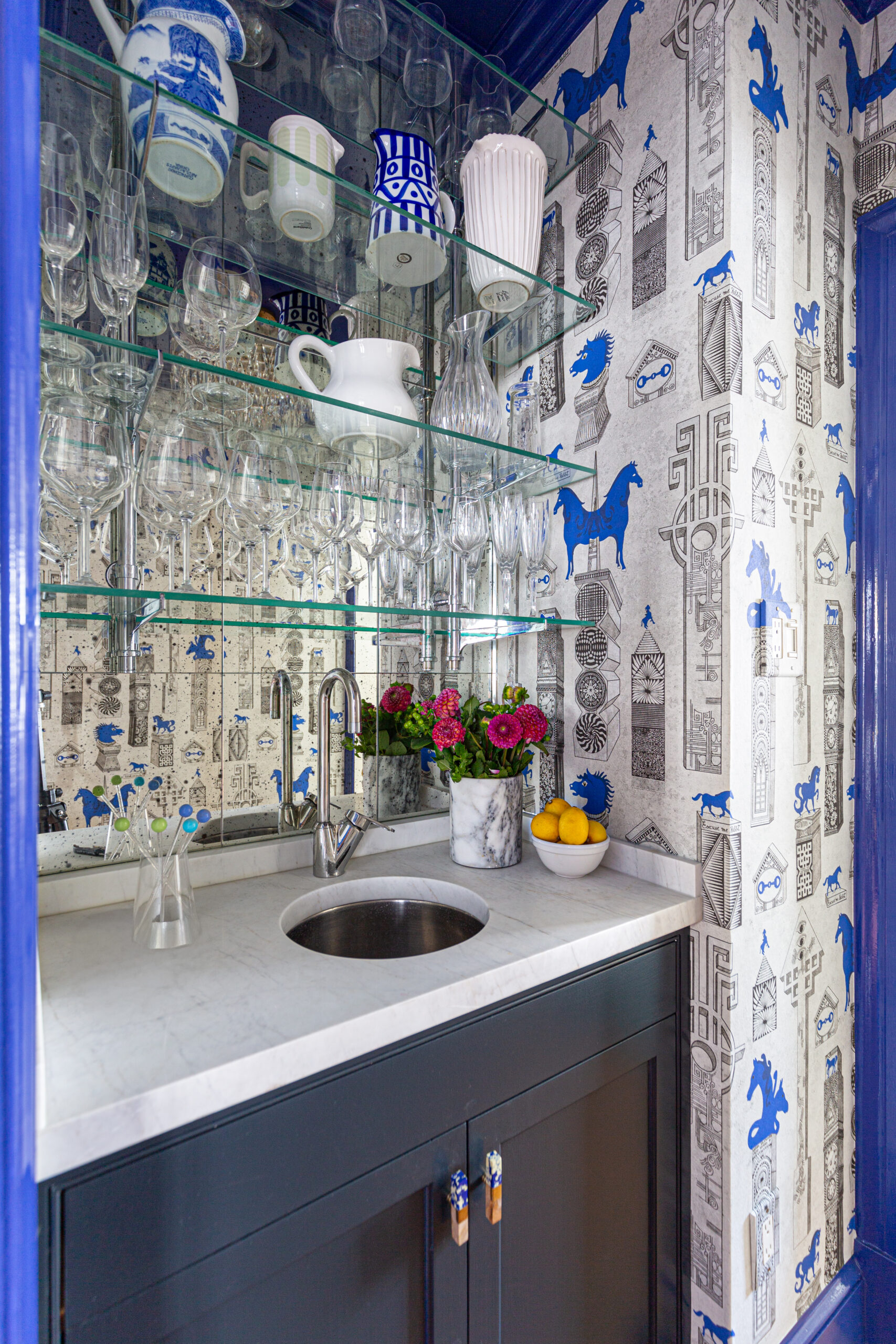 glamorous wet bar, visual comfort, glamorous flush mount, high gloss paint, blue, jennifer shorto wallpaper, marble countertop, custom brass shelving, view to dramatic dining room, chinoiserie<br />
